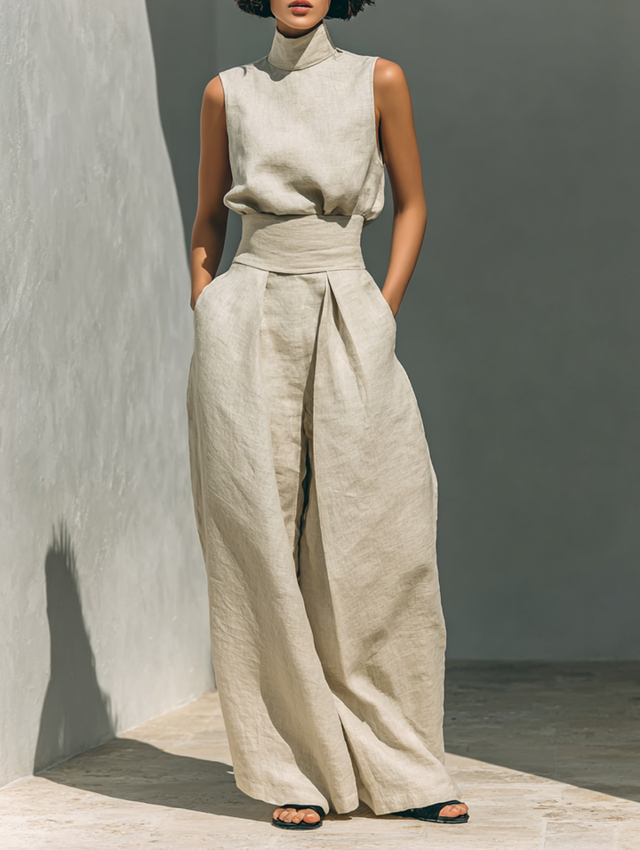 Completo composto da blusa senza maniche e pantaloni a gamba larga in misto cotone e lino.