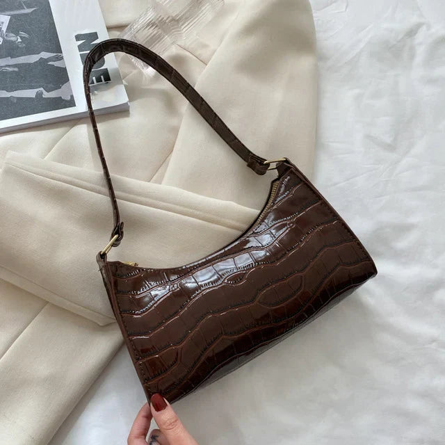 Borsa a tracolla lucida con motivo coccodrillo