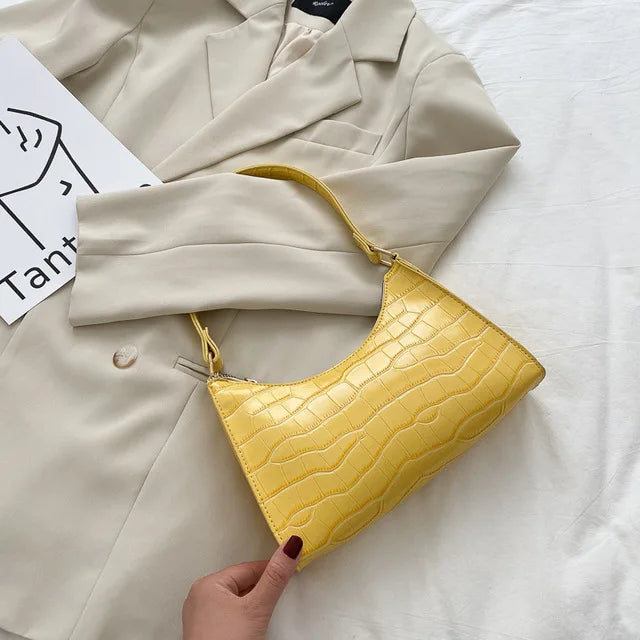 Borsa a tracolla lucida con motivo coccodrillo