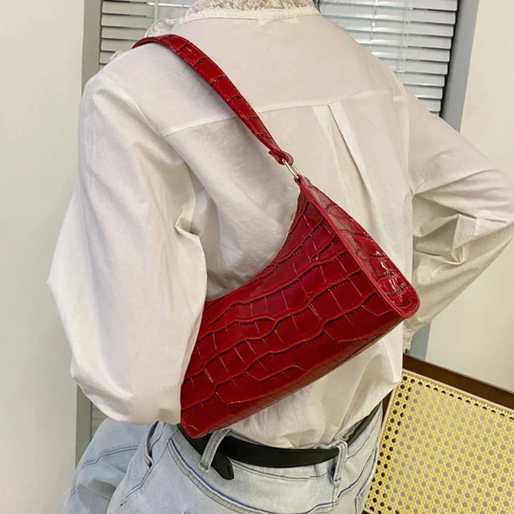 Borsa a tracolla lucida con motivo coccodrillo