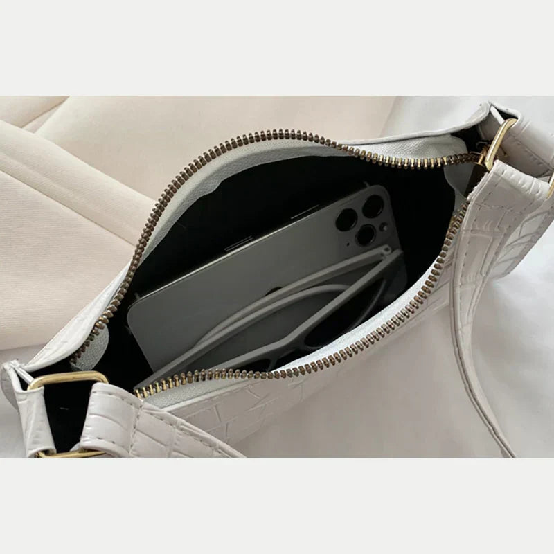 Borsa a tracolla lucida con motivo coccodrillo
