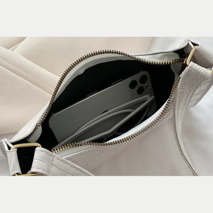 Borsa a tracolla lucida con motivo coccodrillo