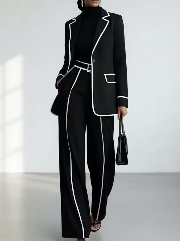 Completo due pezzi con blazer a contrasto con piping e pantaloni a gamba larga neri
