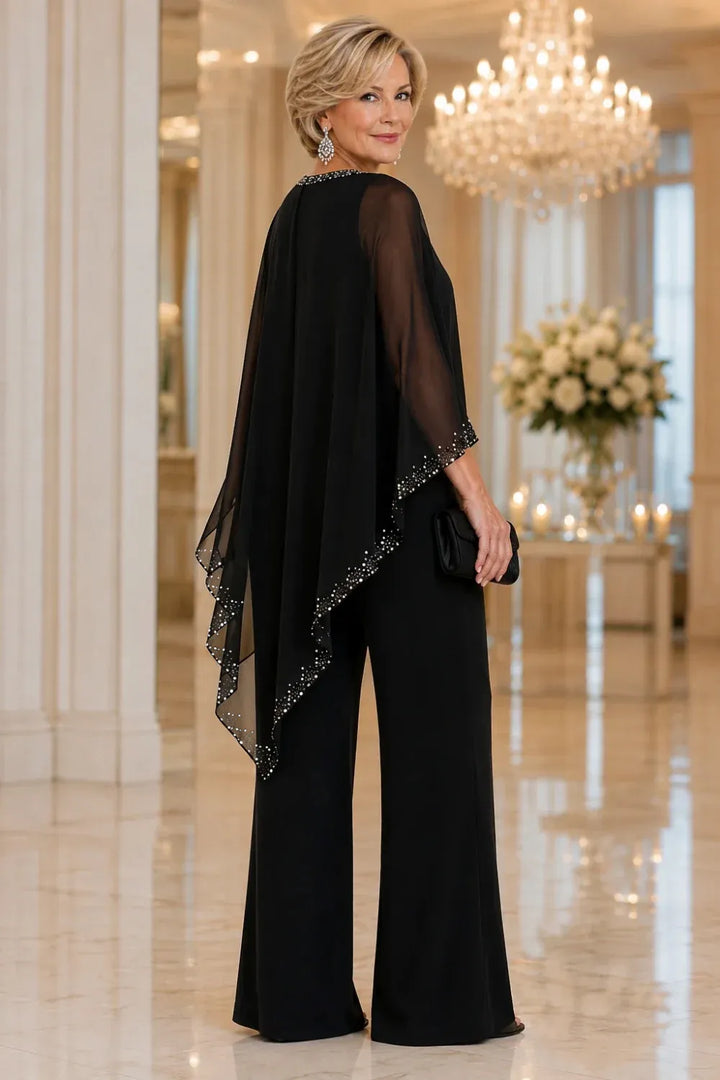 Completo elegante con pantaloni a gamba larga e mantella in chiffon con perline