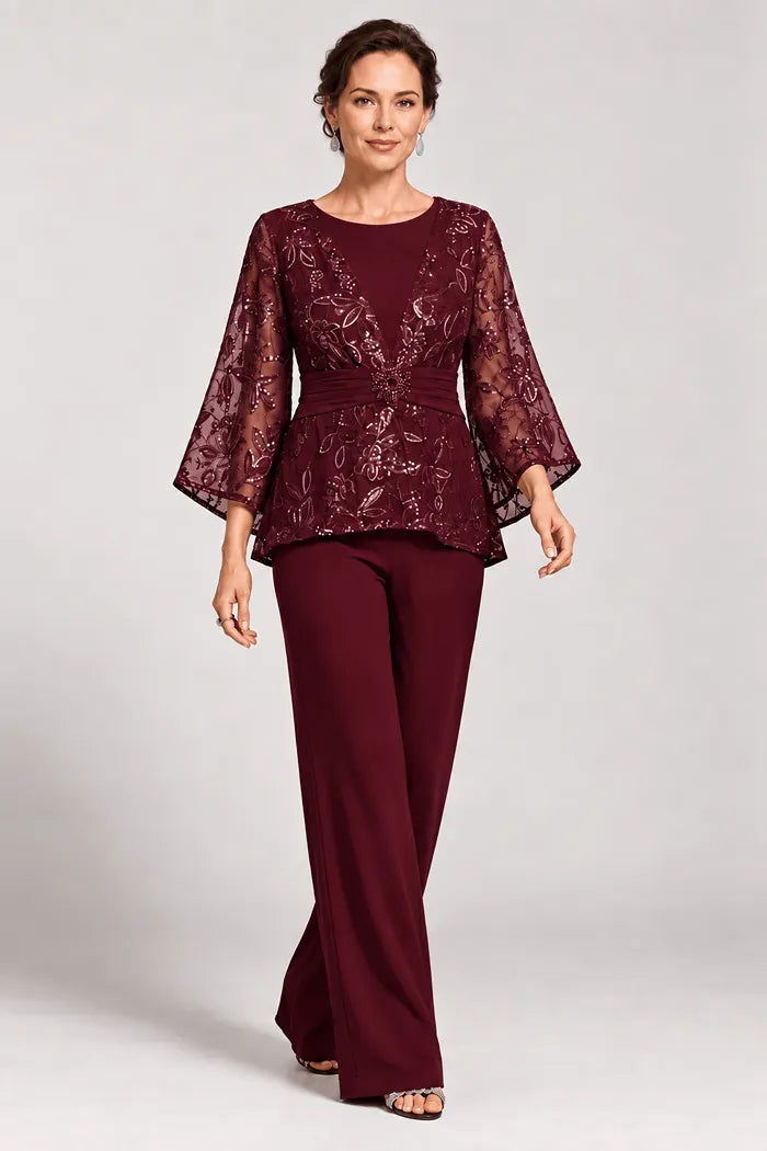 Completo pantalone da sera con maniche a campana velate e decorazioni