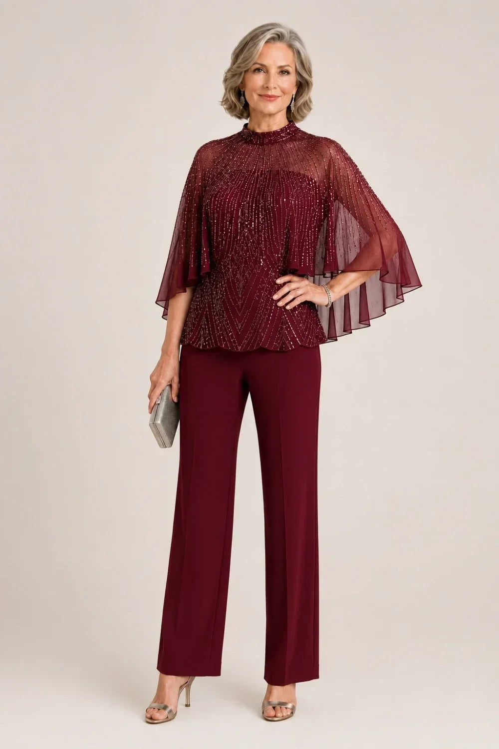 Completo pantalone con cappa in mesh di paillettes e collo alto