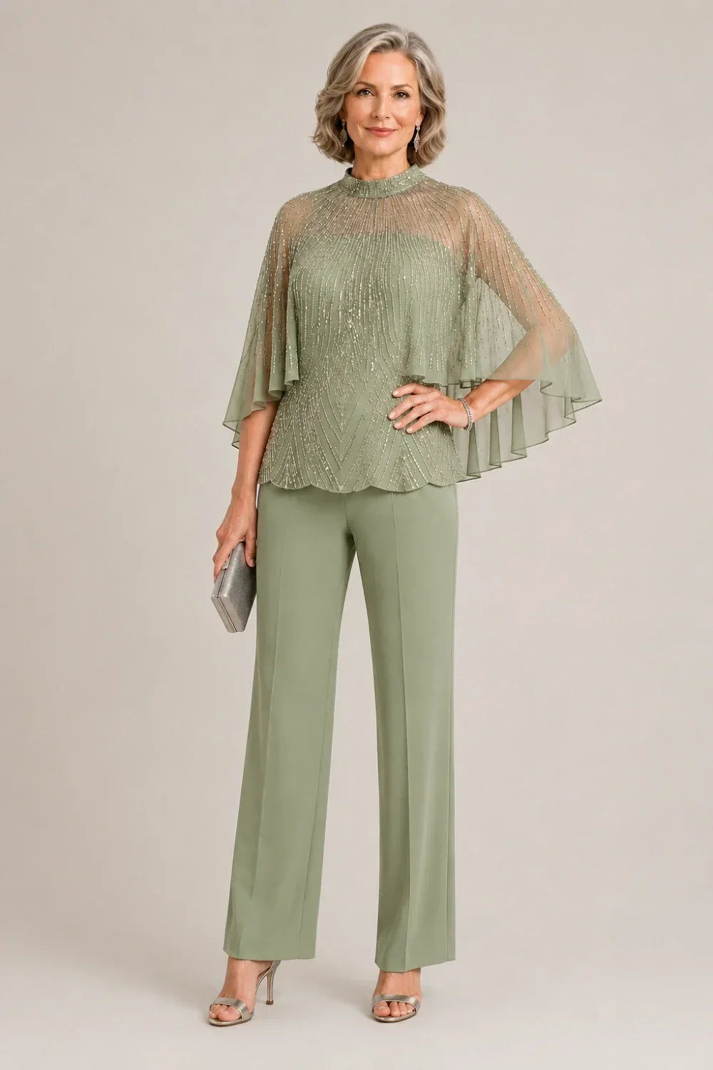 Completo pantalone con cappa in mesh di paillettes e collo alto