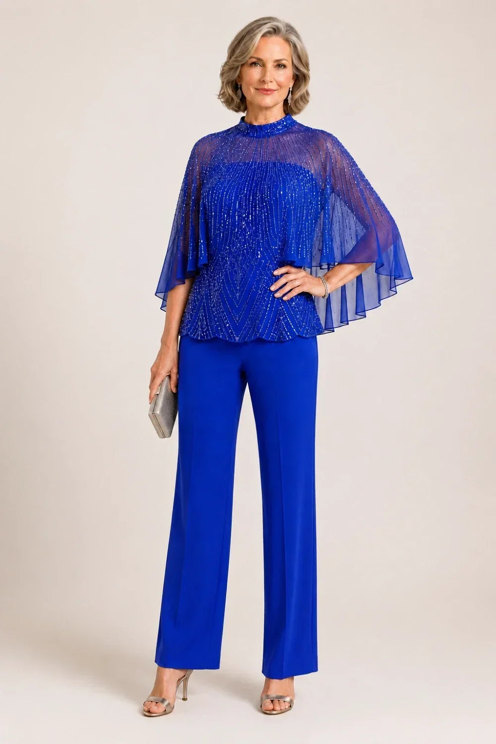 Completo pantalone con cappa in mesh di paillettes e collo alto