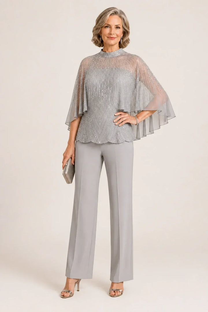 Completo pantalone con cappa in mesh di paillettes e collo alto