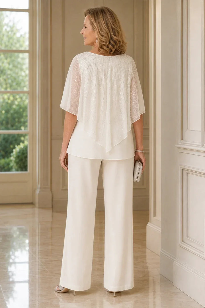 Completo pantalone in chiffon con mantellina di paillettes e pantaloni a gamba larga