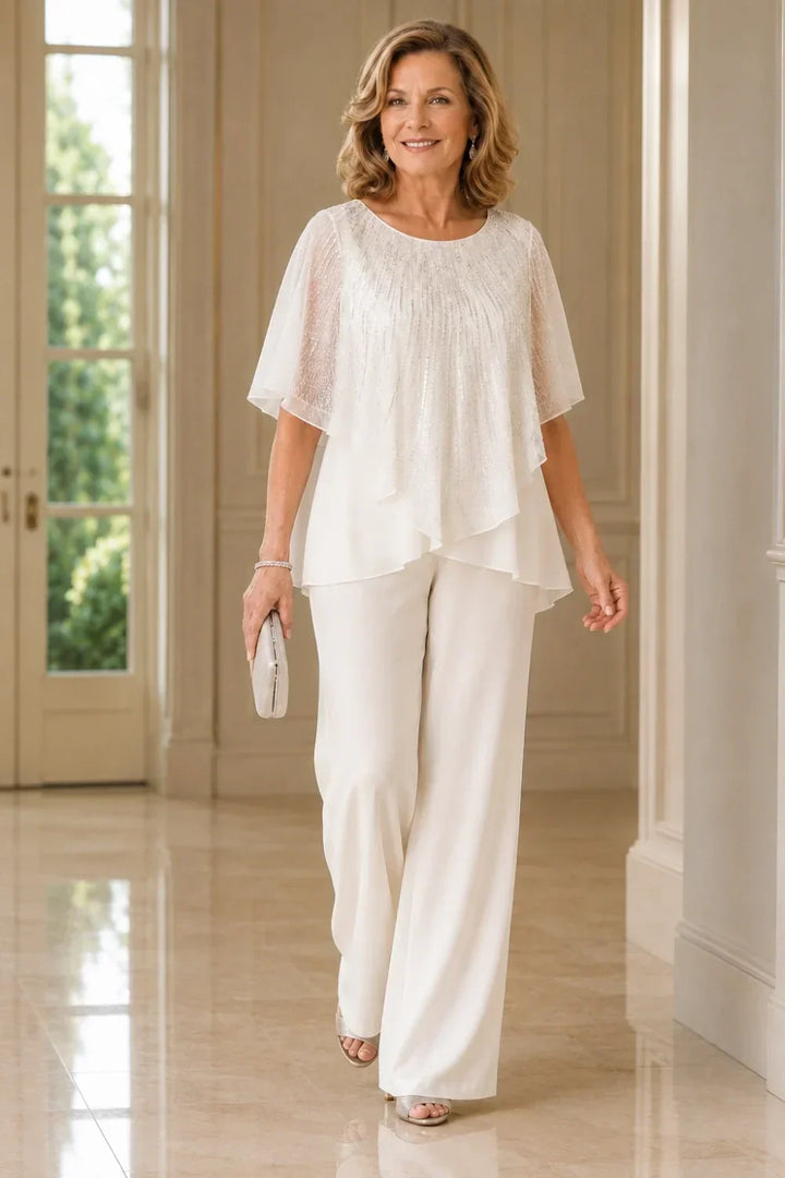 Completo pantalone in chiffon con mantellina di paillettes e pantaloni a gamba larga