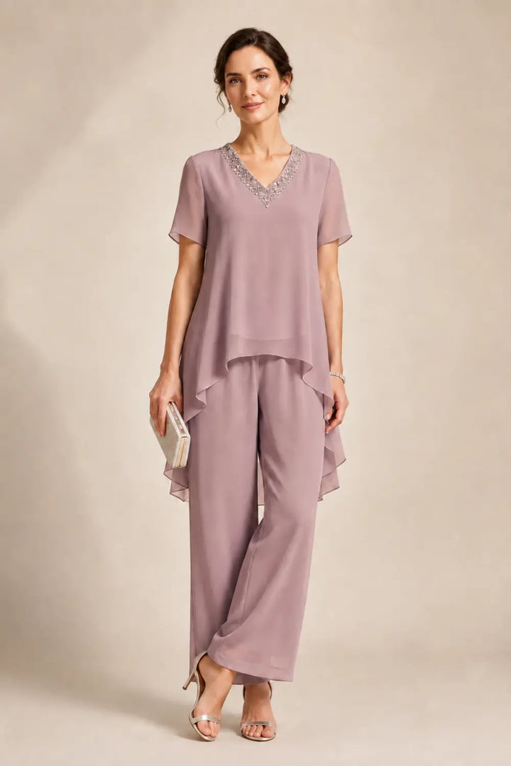 Tuta pantalone asimmetrica con mantella in chiffon e scollo a V