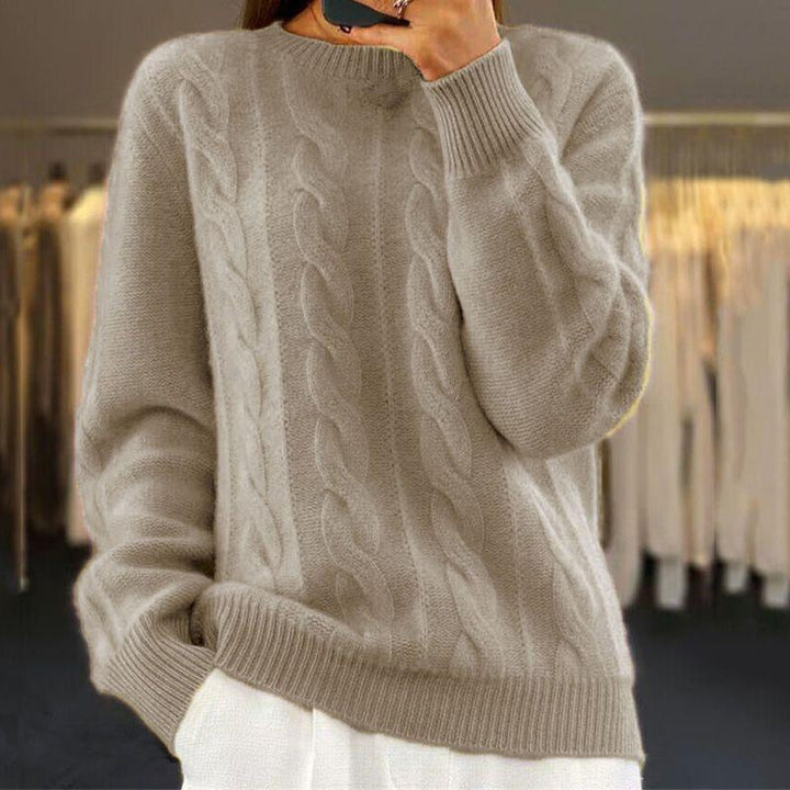 Maglione caldo lavorato a maglia in stile trecce