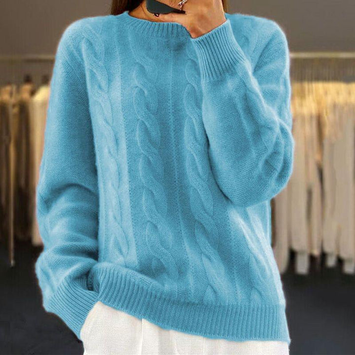 Maglione caldo lavorato a maglia in stile trecce