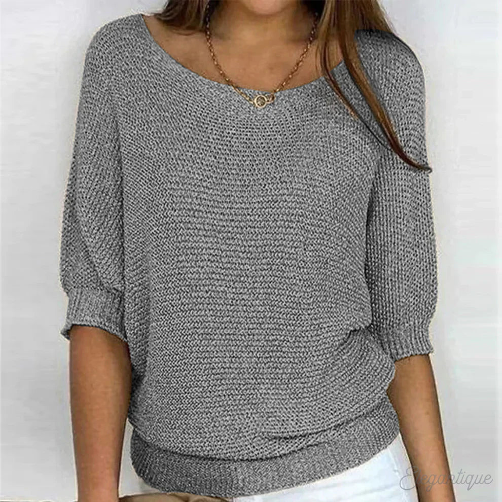 Elegante maglione lavorato a maglia a trecce