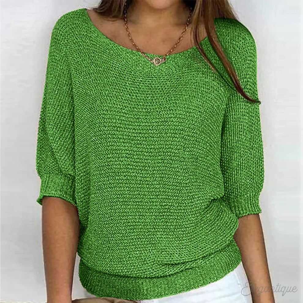 Elegante maglione lavorato a maglia a trecce