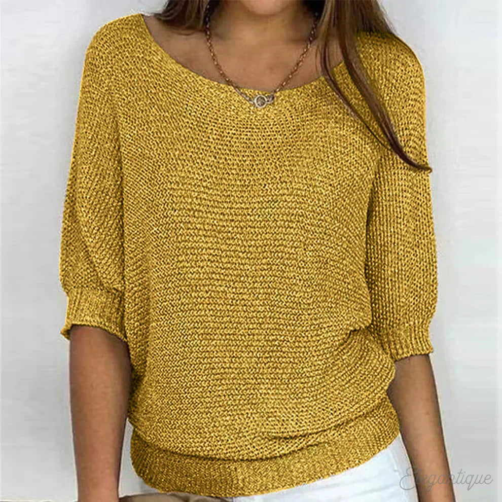 Elegante maglione lavorato a maglia a trecce