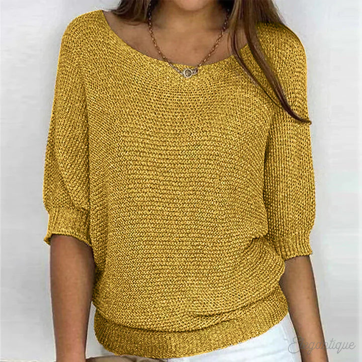 Elegante maglione lavorato a maglia a trecce